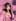 A pixel-art illustration shows a woman with cat-ear headphones in a pink streaming room, made by the 8-Bit Art Generator tool.