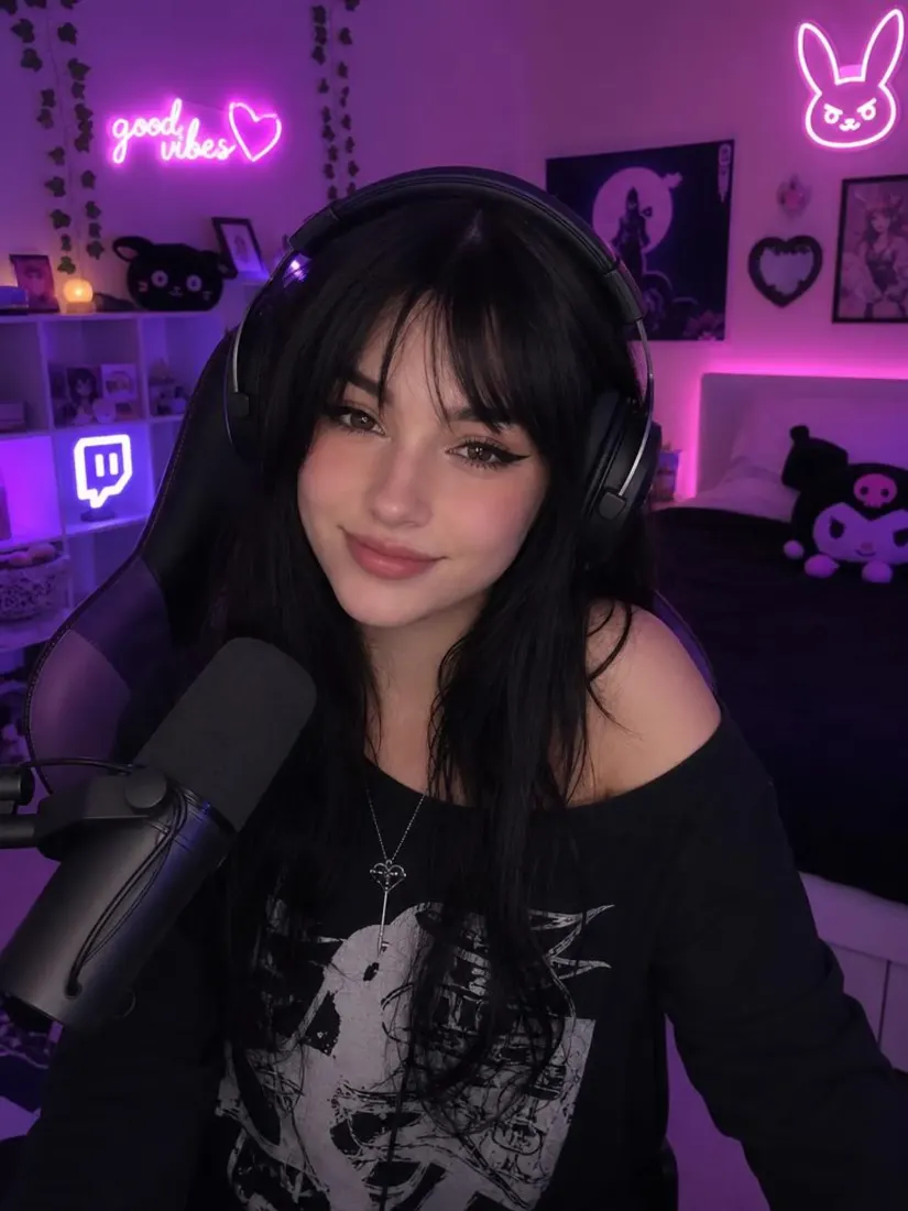 A woman holds a microphone in a purple-lit streaming room, before the 8-Bit Art Generator turns it into pixel art.