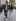 A couple walk arm in arm down a city street, before the Movie Poster Generator casts them in a romance.