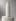 The same bottle and pedestal gain real studio light falloff, true specular highlights and a believable contact shadow from the Realism Enhancer.