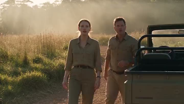 An AI video of two explorers in khaki safari gear stepping out from beside a jeep onto a misty grassland at sunrise.