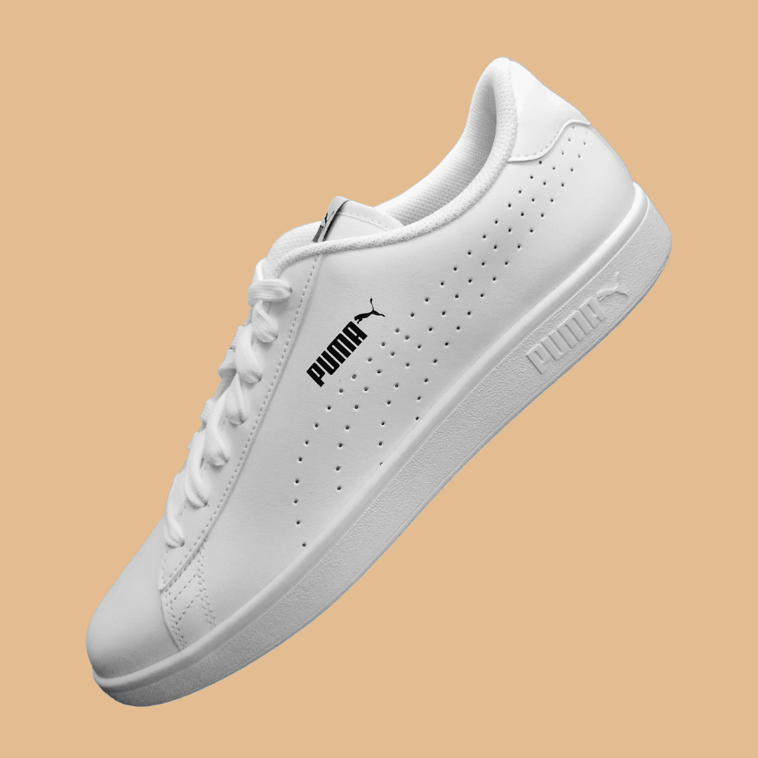 A Puma product photo on a brown background, created with the Background Changer.