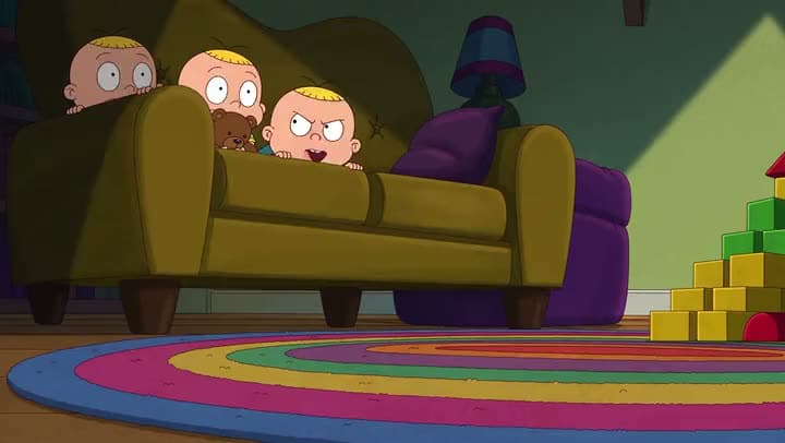 An AI cartoon clip of three bald babies peeking over the back of a green couch in a dim playroom with a rainbow rug.