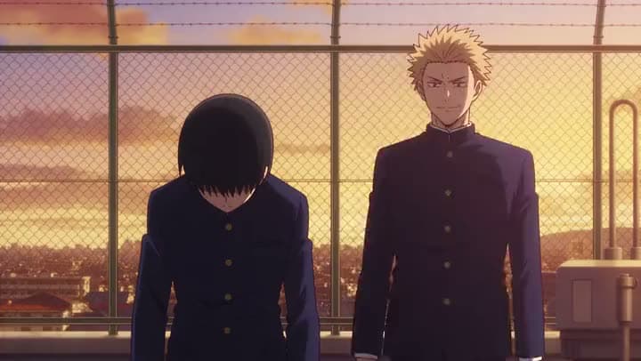 An AI anime clip of two schoolboys in dark uniforms on a fenced rooftop at sunset, one with his head bowed.